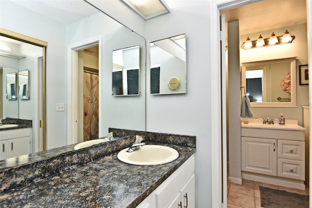 bathroom featuring tile patterned floors and vanity