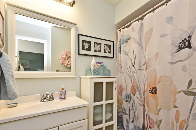 bathroom with vanity and walk in shower