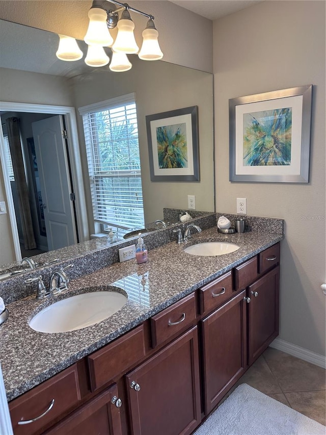 bathroom with tile patterned flooring and vanity