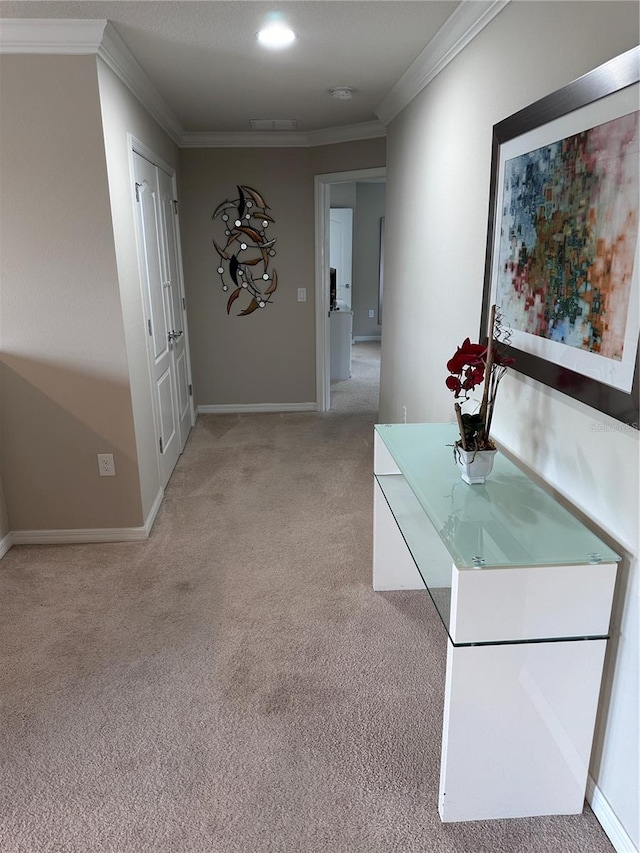 corridor with light colored carpet and ornamental molding