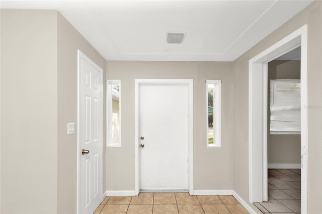 entrance foyer featuring light tile patterned floors