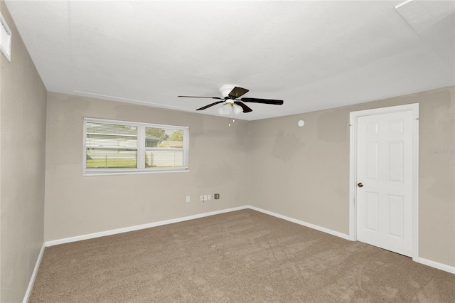 carpeted empty room with ceiling fan