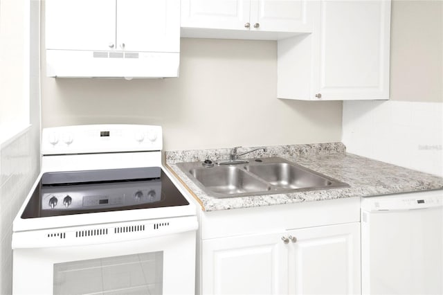 kitchen with extractor fan, sink, backsplash, white appliances, and white cabinets