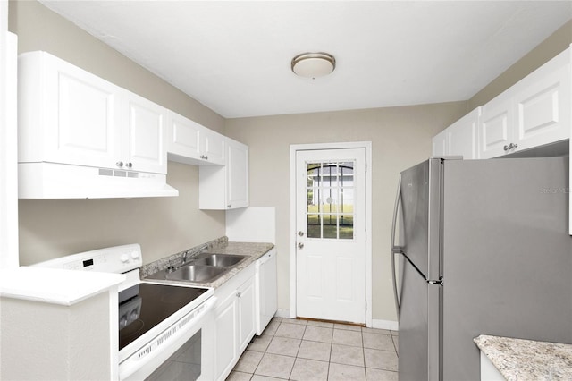 kitchen with white cabinets, sink, white appliances, and light tile patterned flooring