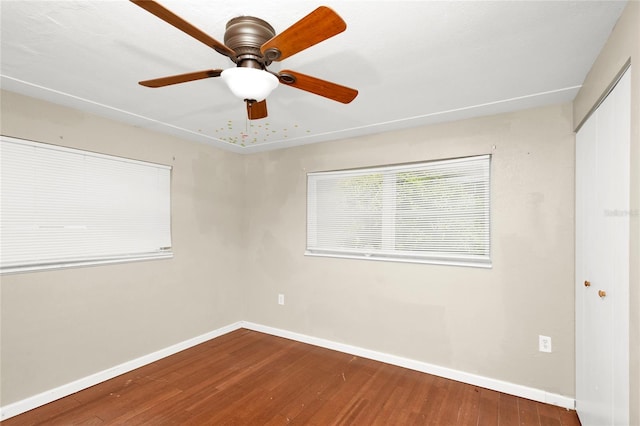 unfurnished room with hardwood / wood-style flooring and ceiling fan