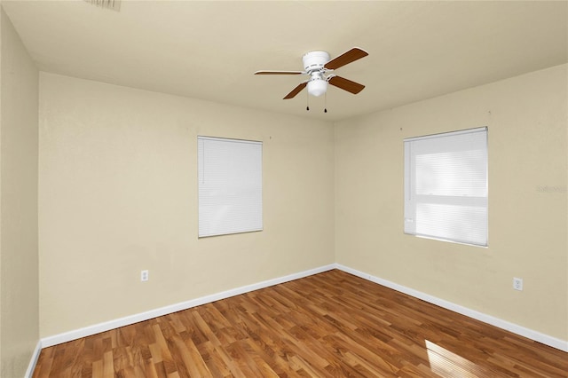 unfurnished room featuring hardwood / wood-style flooring and ceiling fan