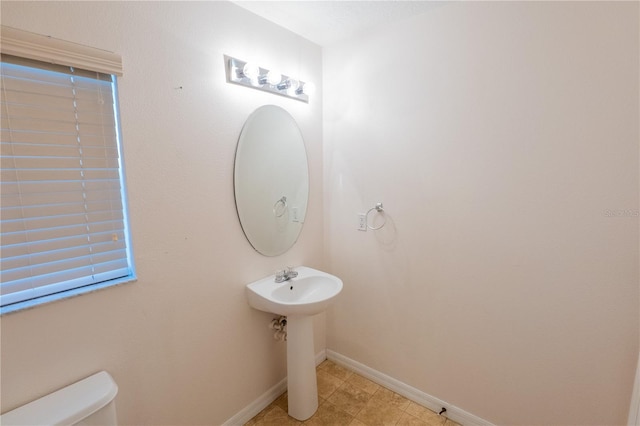 bathroom with tile patterned floors and toilet