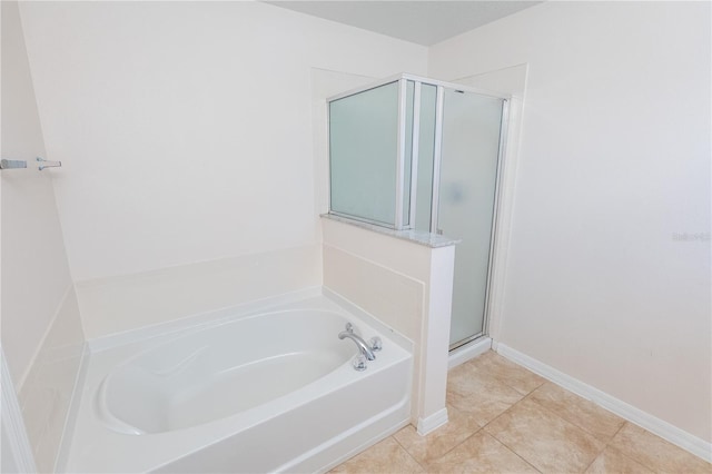 bathroom featuring plus walk in shower and tile patterned flooring