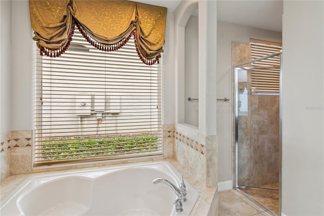 bathroom featuring radiator heating unit and independent shower and bath