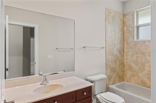 full bathroom featuring vanity, toilet, and tiled shower / bath