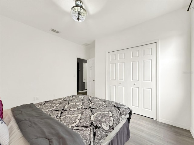 bedroom featuring a closet and light hardwood / wood-style flooring