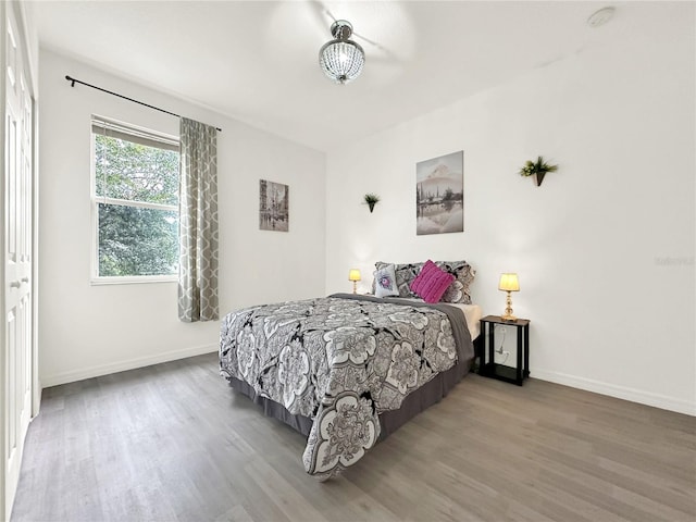 bedroom with hardwood / wood-style floors