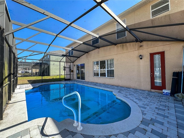 view of pool featuring a lanai and a patio area