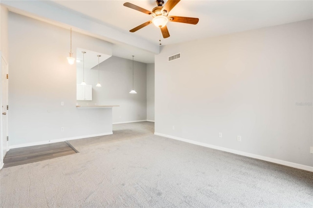 carpeted empty room with ceiling fan