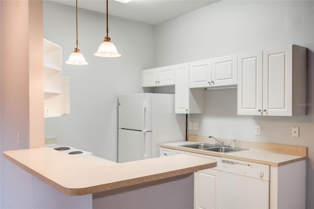 kitchen with white cabinets, kitchen peninsula, sink, pendant lighting, and white appliances