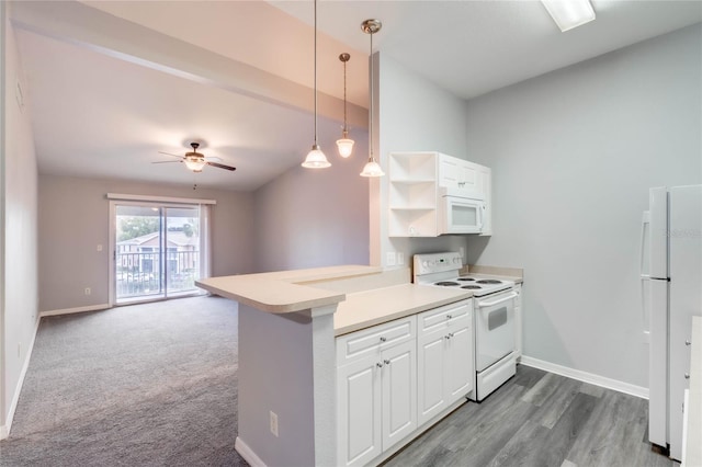 kitchen with white appliances, white cabinetry, decorative light fixtures, and kitchen peninsula