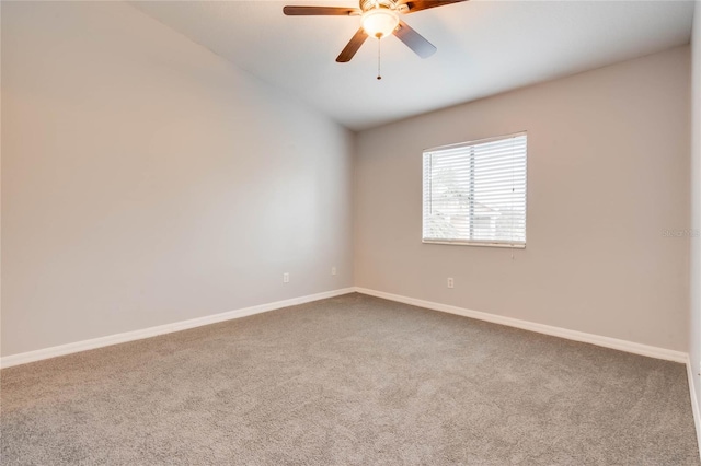 empty room featuring ceiling fan and carpet floors