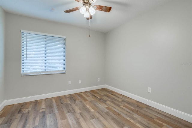 spare room with ceiling fan and light hardwood / wood-style floors