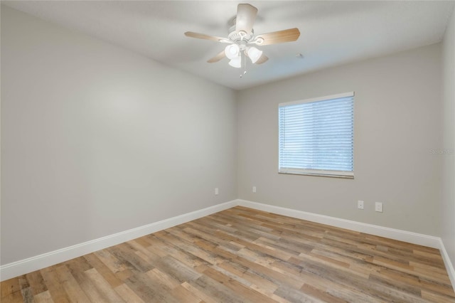 spare room featuring ceiling fan and light hardwood / wood-style floors