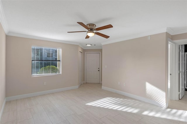 unfurnished room featuring ceiling fan and ornamental molding