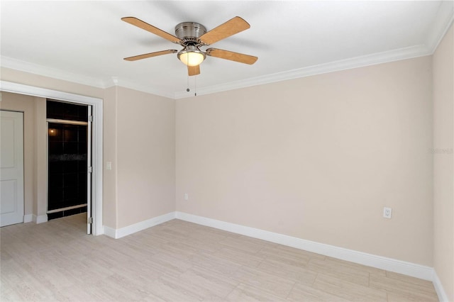 spare room featuring ceiling fan and ornamental molding