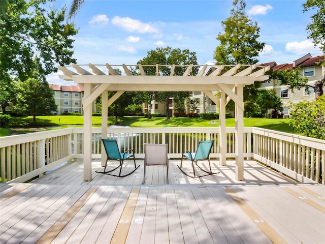 wooden terrace featuring a yard