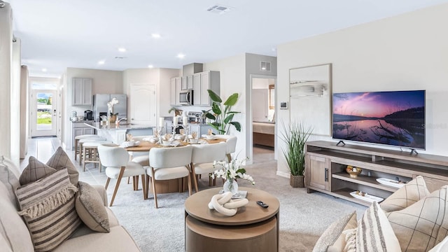 living room with light colored carpet