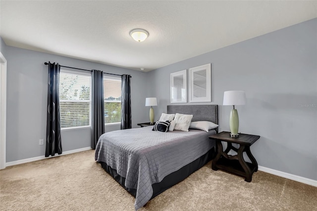 carpeted bedroom with a textured ceiling