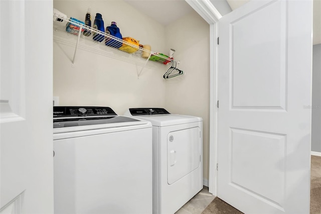 washroom with independent washer and dryer