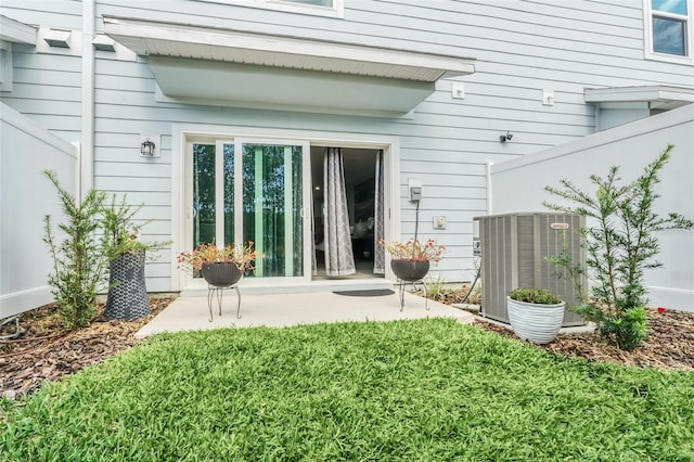 back of property featuring cooling unit and a patio area