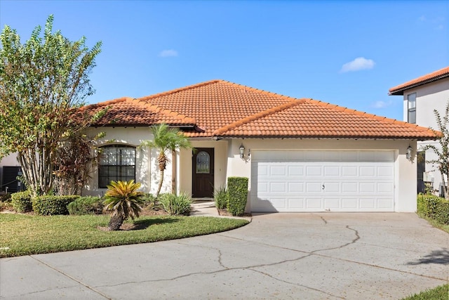 mediterranean / spanish-style home featuring a garage