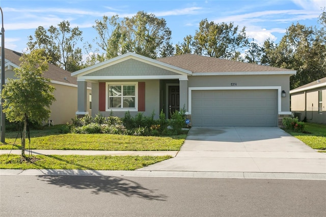 single story home with a garage and a front lawn