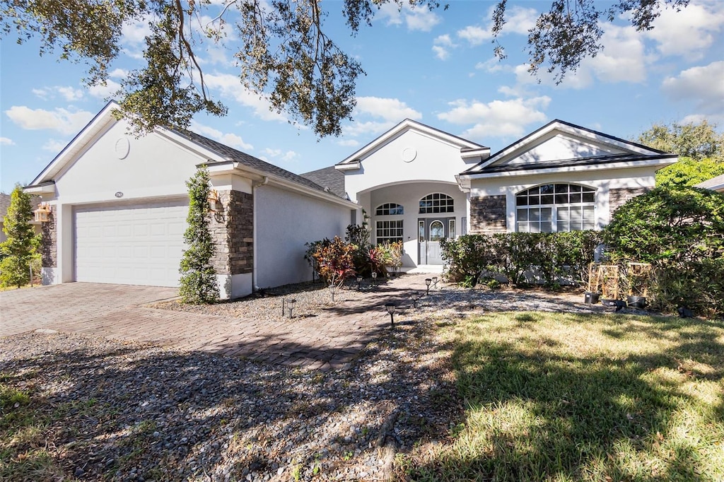 single story home with a garage