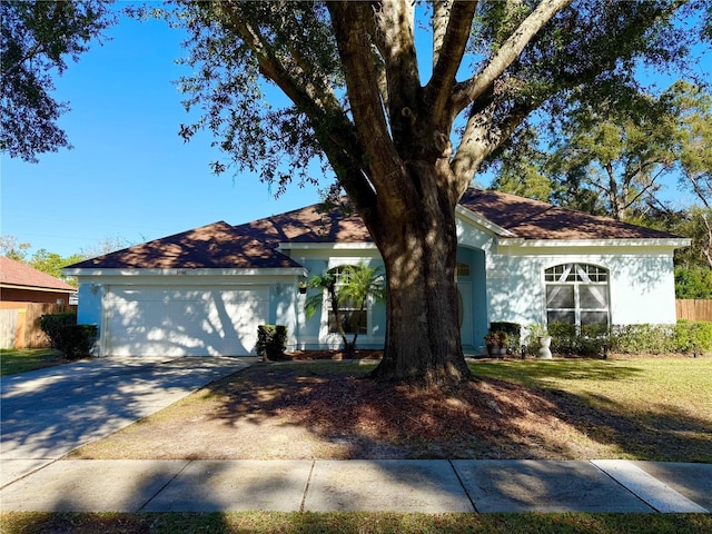 ranch-style house with a front lawn and a garage