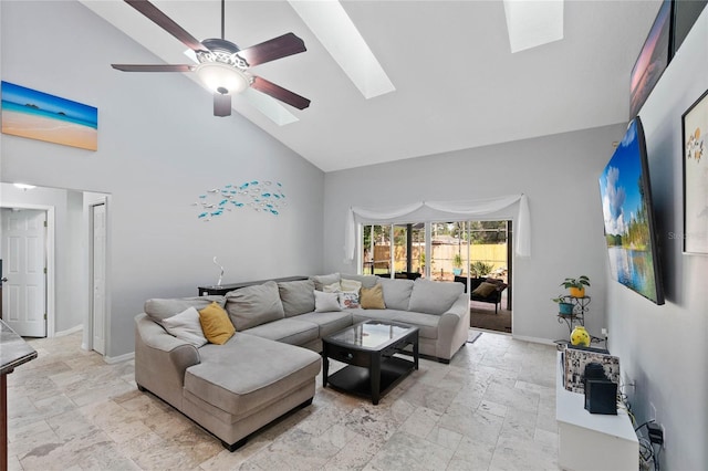 living room featuring a skylight, high vaulted ceiling, and ceiling fan