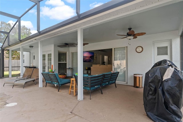 view of patio featuring french doors, a lanai, a grill, ceiling fan, and an outdoor living space