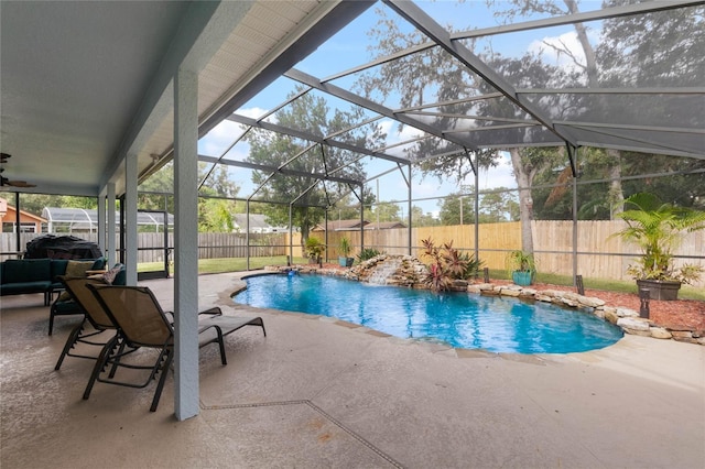 view of pool featuring a patio, a lanai, and pool water feature