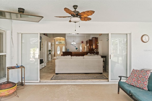 living room featuring ceiling fan