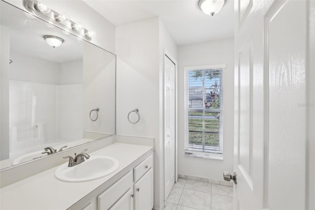 bathroom featuring tile patterned flooring and vanity