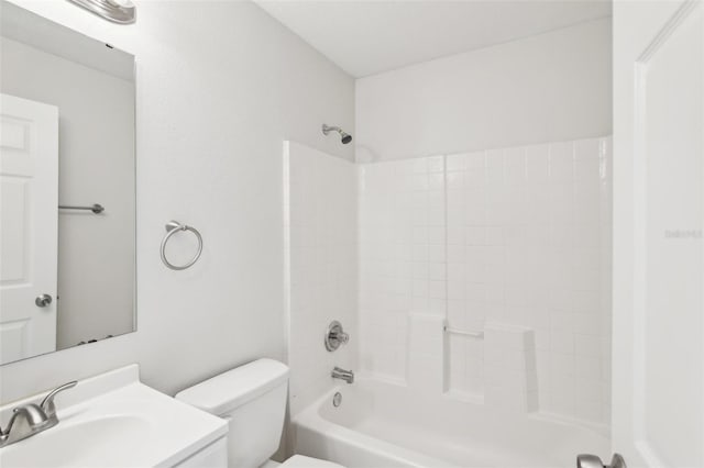 full bathroom with toilet, vanity, and washtub / shower combination