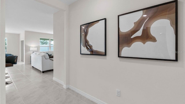 corridor featuring light tile patterned floors