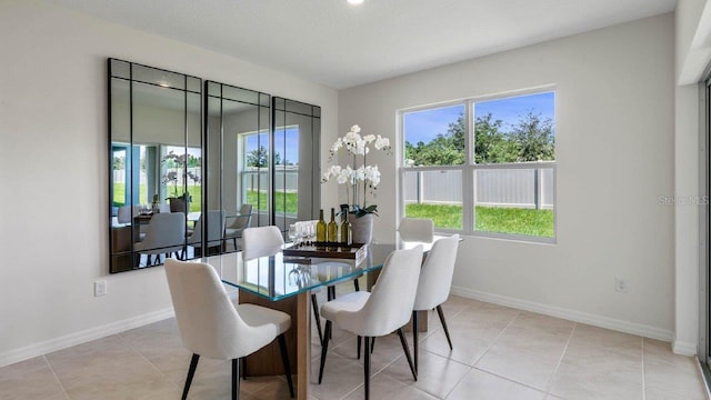 dining room featuring a textured ceiling and light tile patterned floors