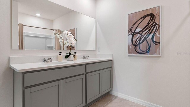 bathroom with tile patterned flooring and vanity