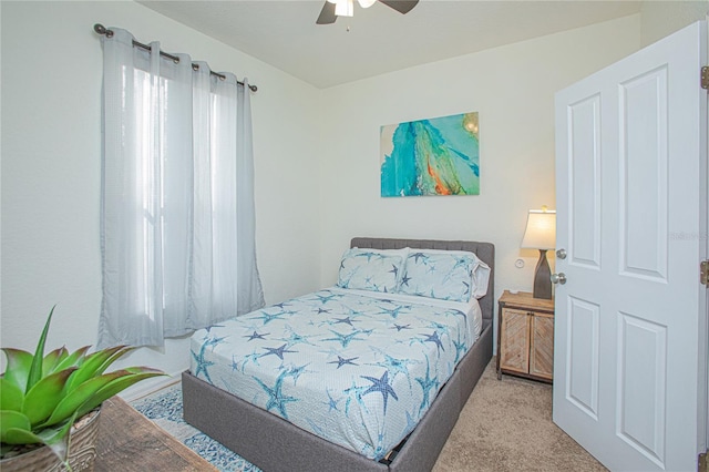 bedroom with light colored carpet and ceiling fan