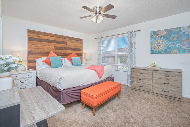 121 Palermo St, Davenport, FL 33897 - bedroom with light carpet, ceiling fan, baseboards, and a textured ceiling