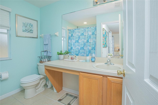 bathroom with tile patterned floors, walk in shower, vanity, and toilet