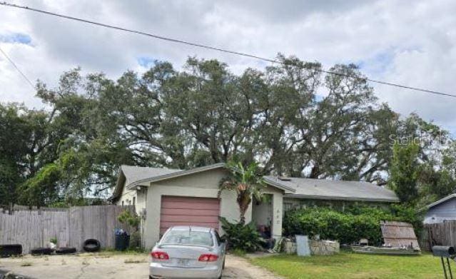 single story home with a garage