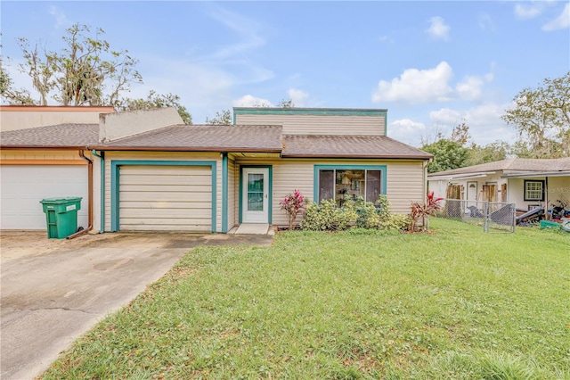 view of front of property with a garage and a front lawn