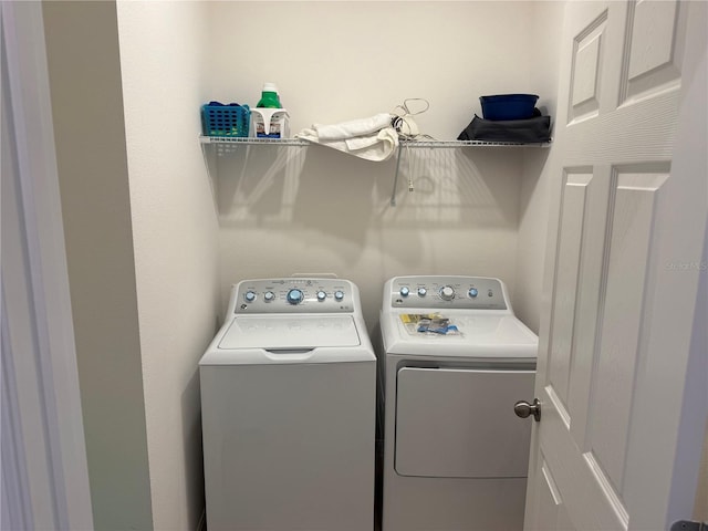 laundry room featuring separate washer and dryer