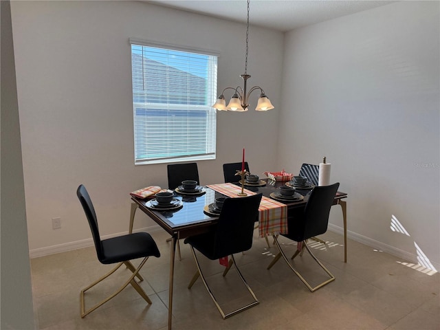 dining space featuring a chandelier